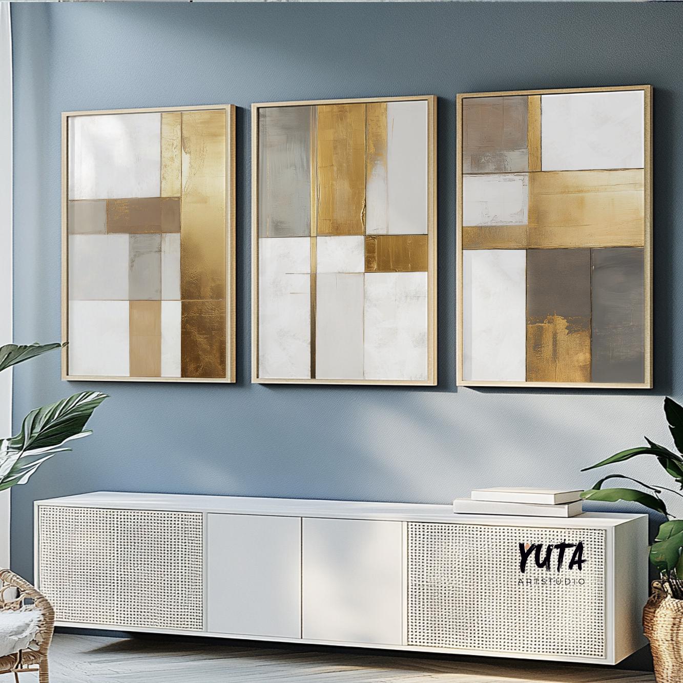 Abstract gold and neutral geometric wall art trio shown above a sideboard for sizing reference
