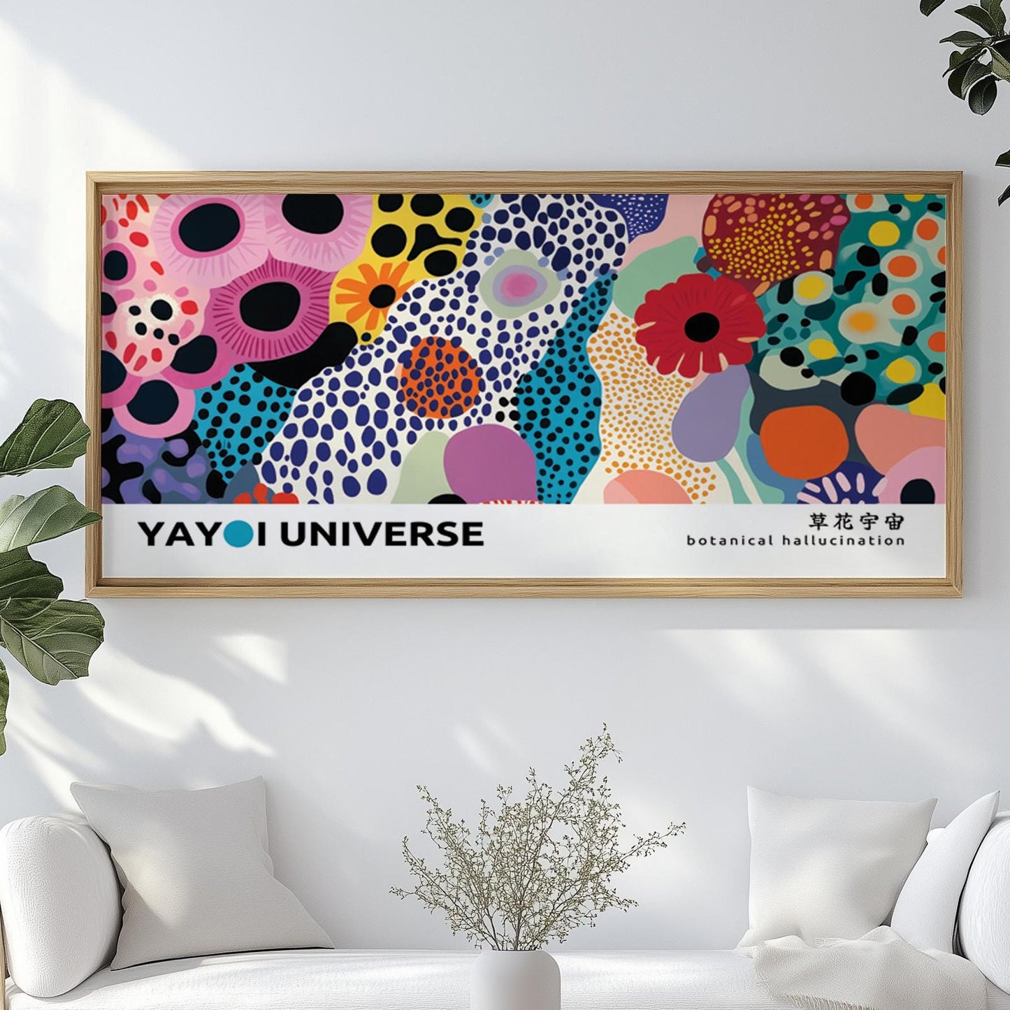Colorful abstract floral artwork in a light wood frame displayed above a white sofa.