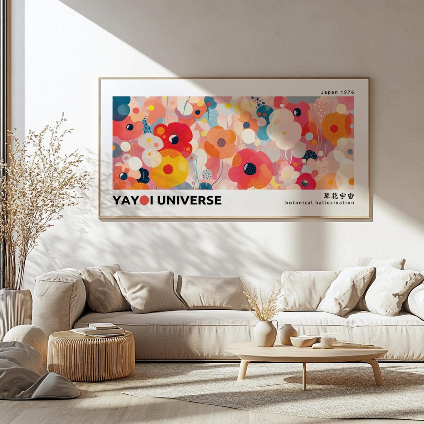 Large framed pink floral wall art displayed above a neutral sofa in natural light