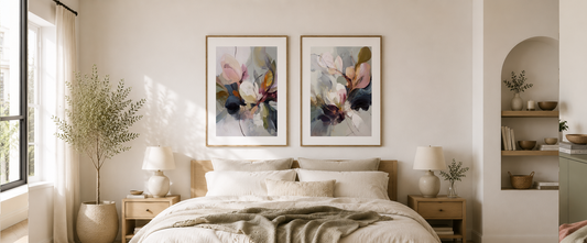 Minimalist Scandinavian bedroom with two blank framed wall art mockups above the bed, featuring white walls, neutral décor, natural wood accents and soft morning light.