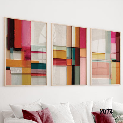 Colorful abstract geometric wall art set of three prints featuring bold blocks of red, yellow, teal, and pink.