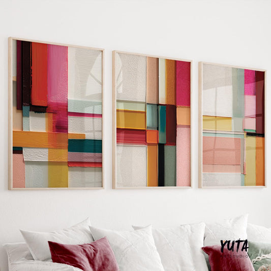 Colorful abstract geometric wall art set of three prints featuring bold blocks of red, yellow, teal, and pink.