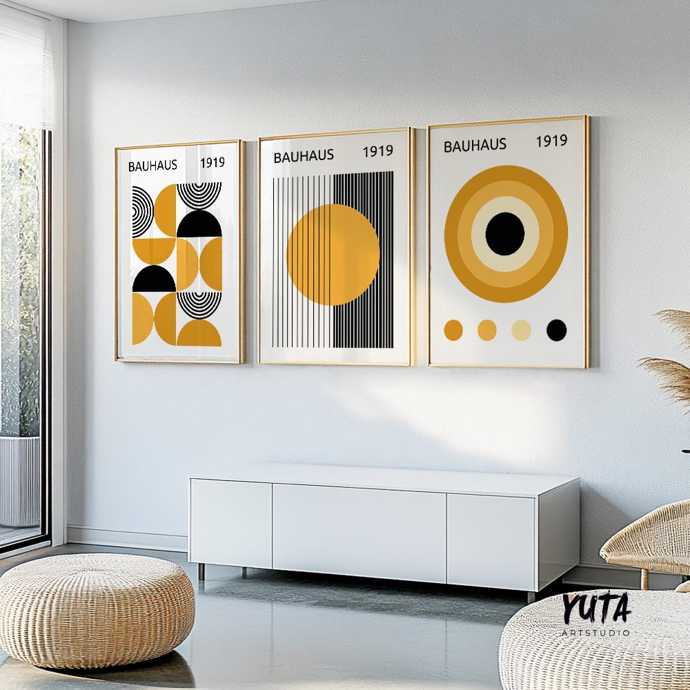Framed Bauhaus abstract prints in yellow and black, shown as a shipped three-piece set.