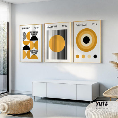 Framed Bauhaus abstract prints in yellow and black, shown as a shipped three-piece set.