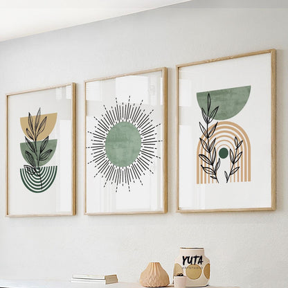 Wall art size guide showing three framed boho prints above decorative ceramics and books