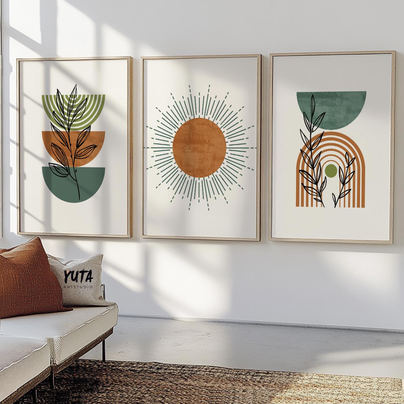 Three framed boho abstract prints with terracotta and green tones styled above a console