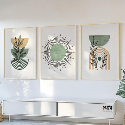 Three framed sage green boho prints arranged above a low white sofa or bench.