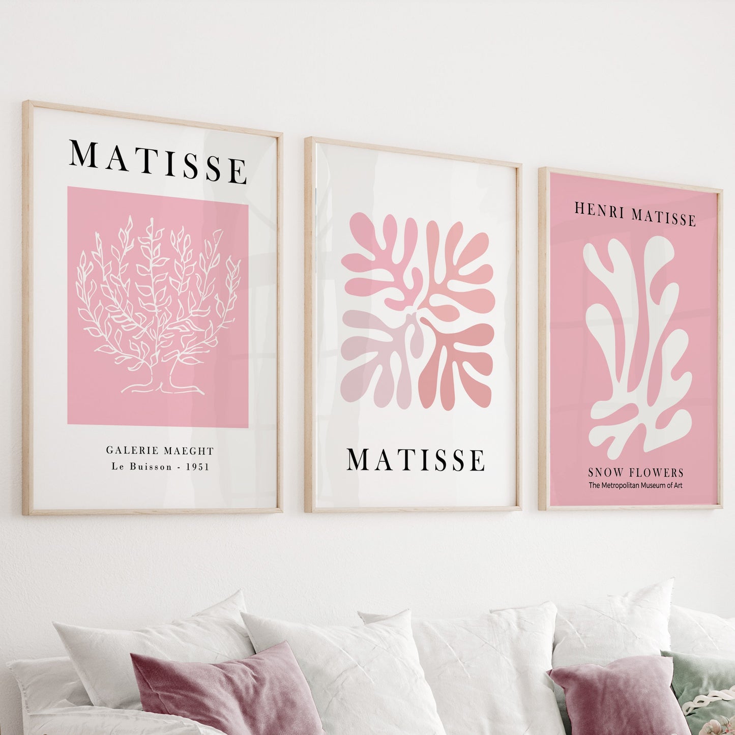 Abstract botanical and organic pastel pink line art prints in light wood frames, set of three