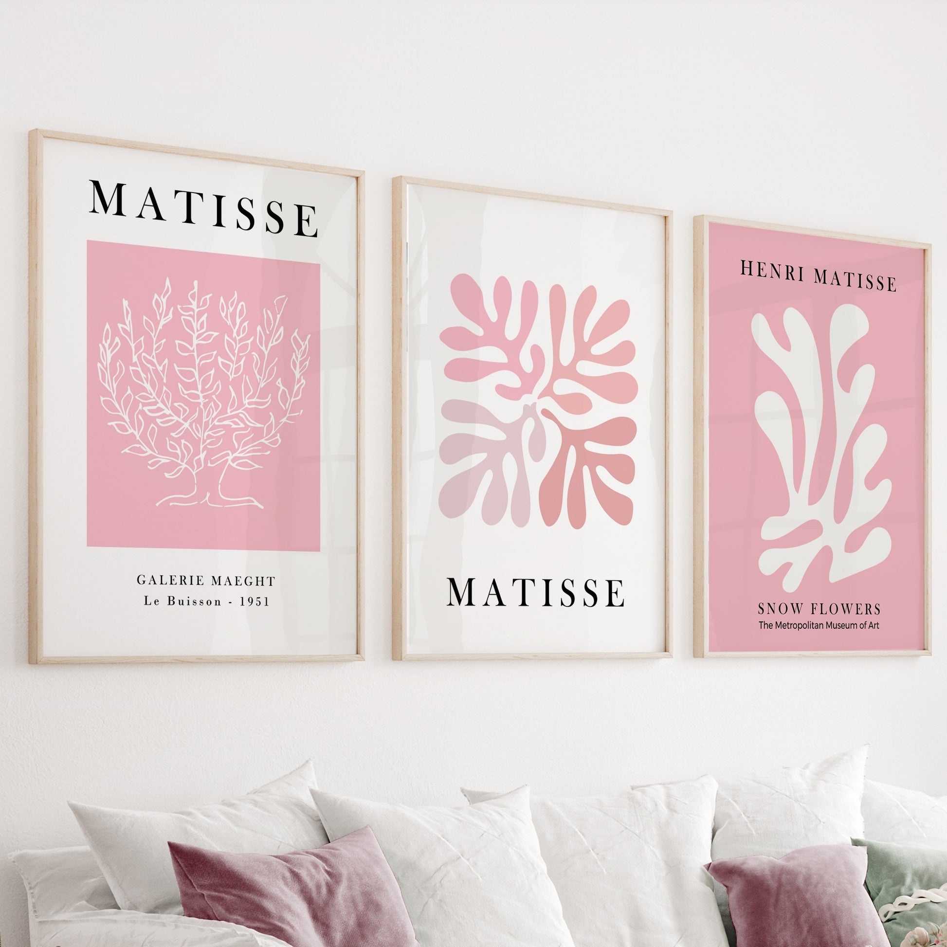 Abstract botanical and organic pastel pink line art prints in light wood frames, set of three