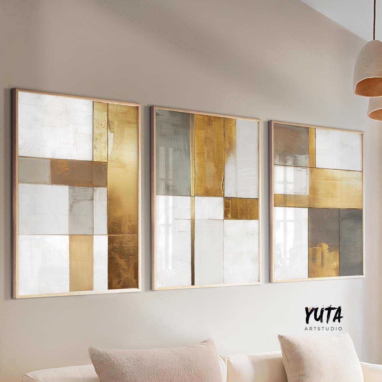 Gold and neutral geometric abstract prints in natural frames above a light console