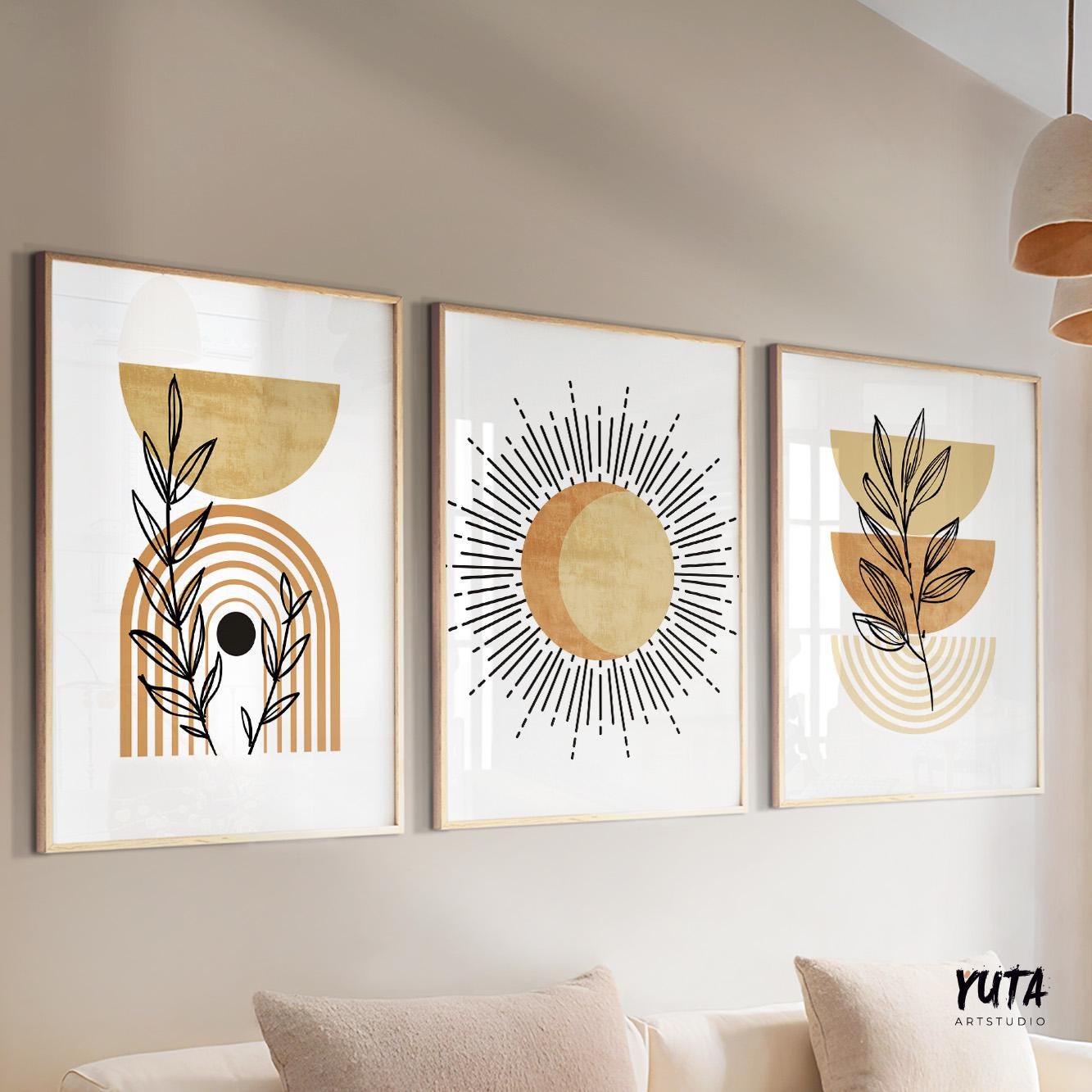 Trio of framed terracotta beige abstract prints in boho style, arranged above a sofa