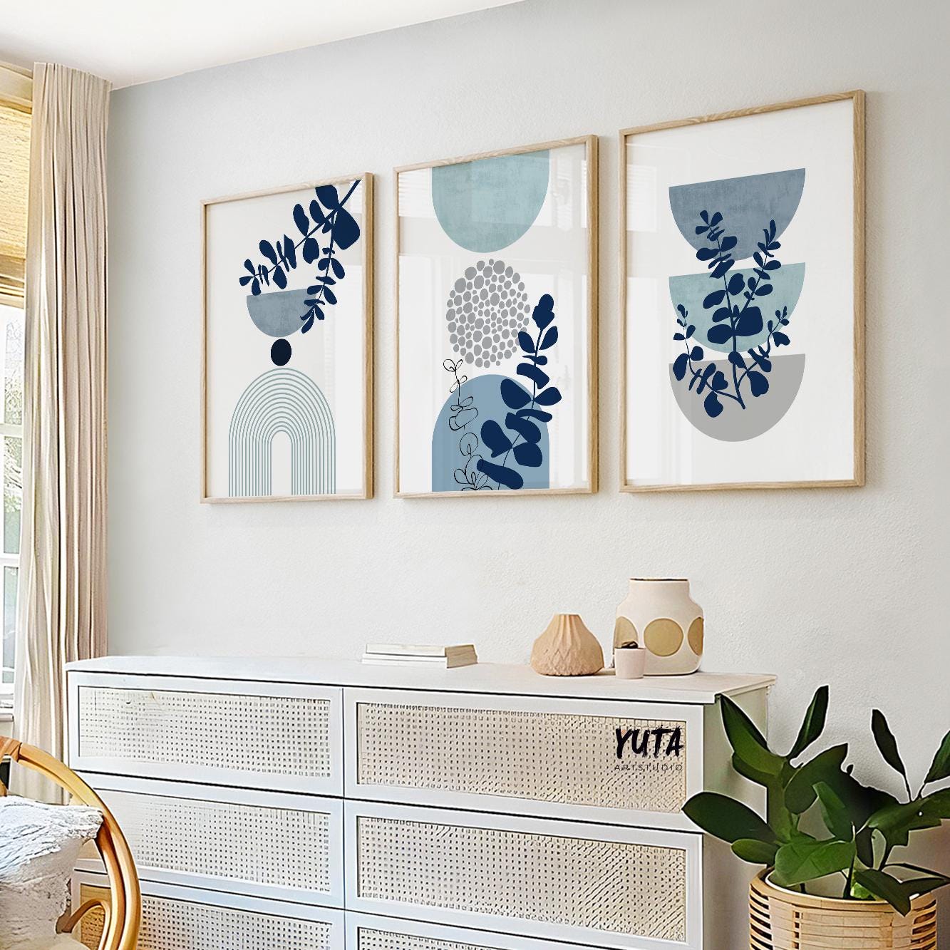 Abstract botanical wall art set with blue leaf motifs, geometric circles and organic modern aesthetics