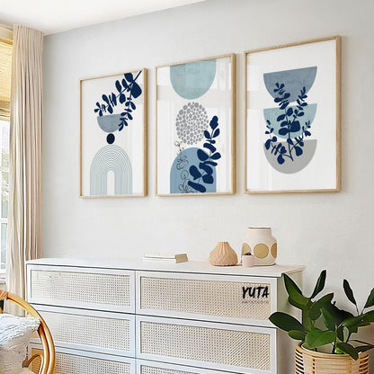 Abstract botanical wall art set with blue leaf motifs, geometric circles and organic modern aesthetics