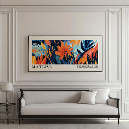 Vivid tropical floral Matisse-style artwork in a black frame hung above a classic sofa