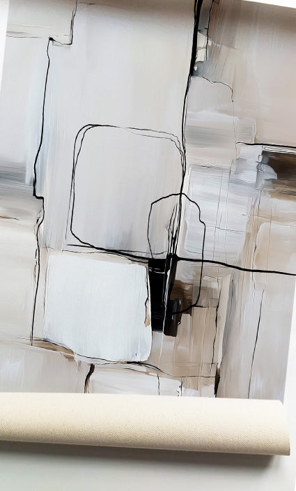 An abstract canvas wall art print featuring minimalist black line drawings on a textured background of off-white, beige, and light gray, with a rolled canvas edge visible at the bottom.