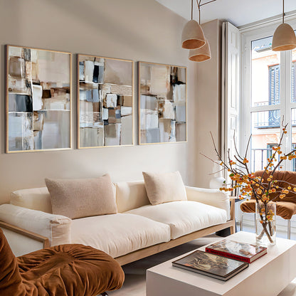 Beige abstract wall art triptych with modern geometric shapes and subtle black accents in a warm neutral palette.