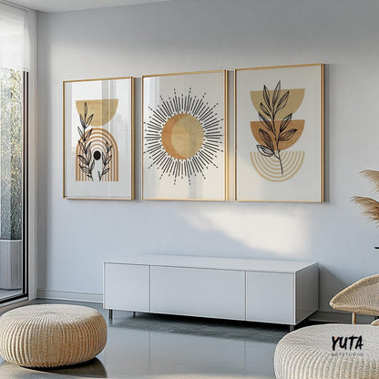 Framed terracotta abstract prints in a trio above a natural woven ottoman and seating area