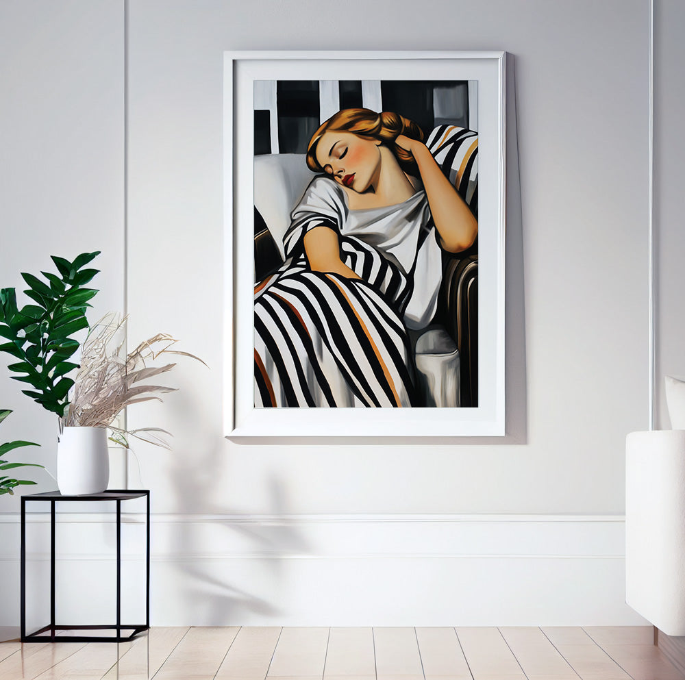 Black and white feminine wall art with a resting woman and graphic striped details