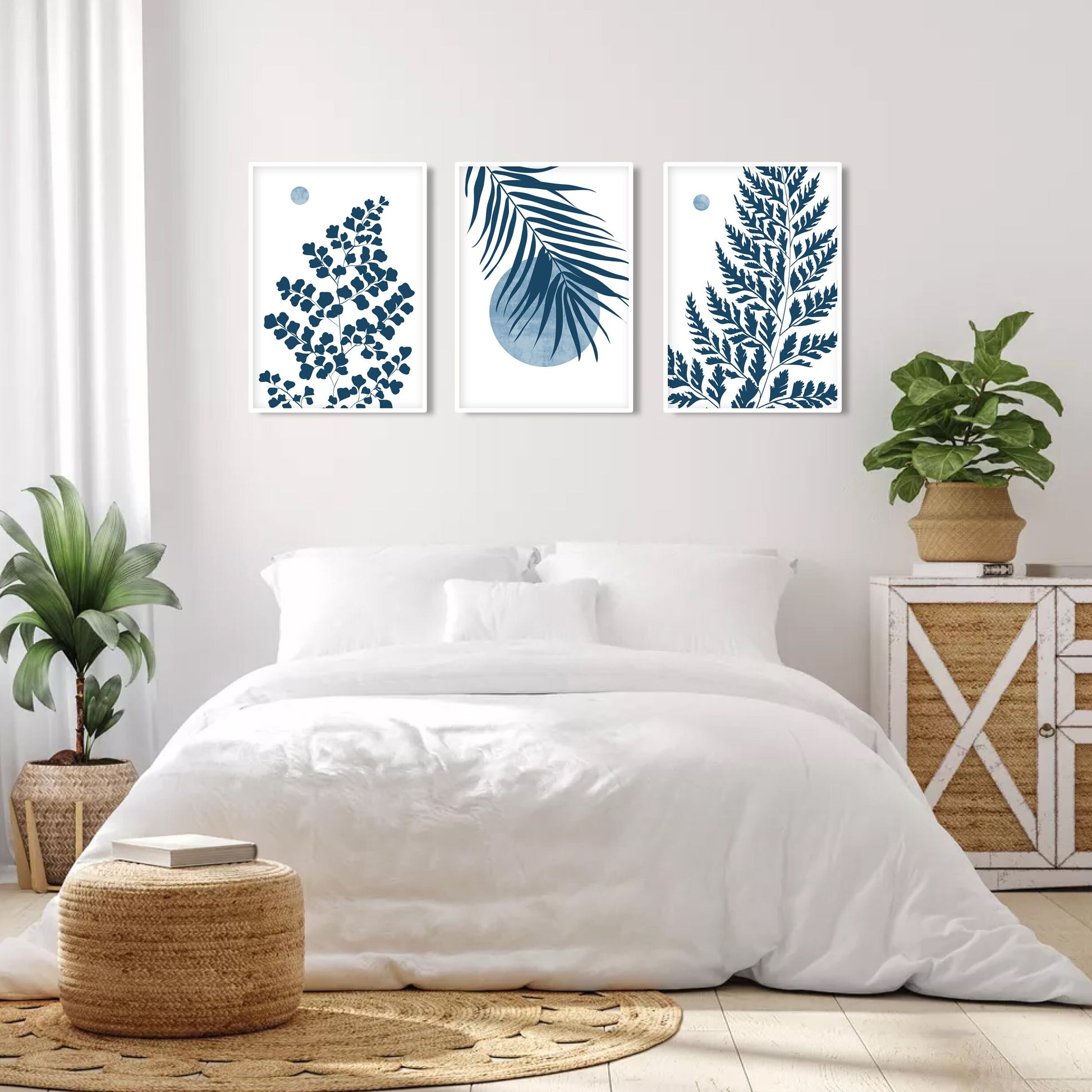 Blue botanical gallery wall set showcasing tropical leaf prints and modern organic design elements