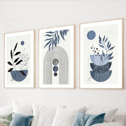 Blue botanical wall art set of 3 featuring abstract geometric shapes and minimalist foliage in dusty blue tones