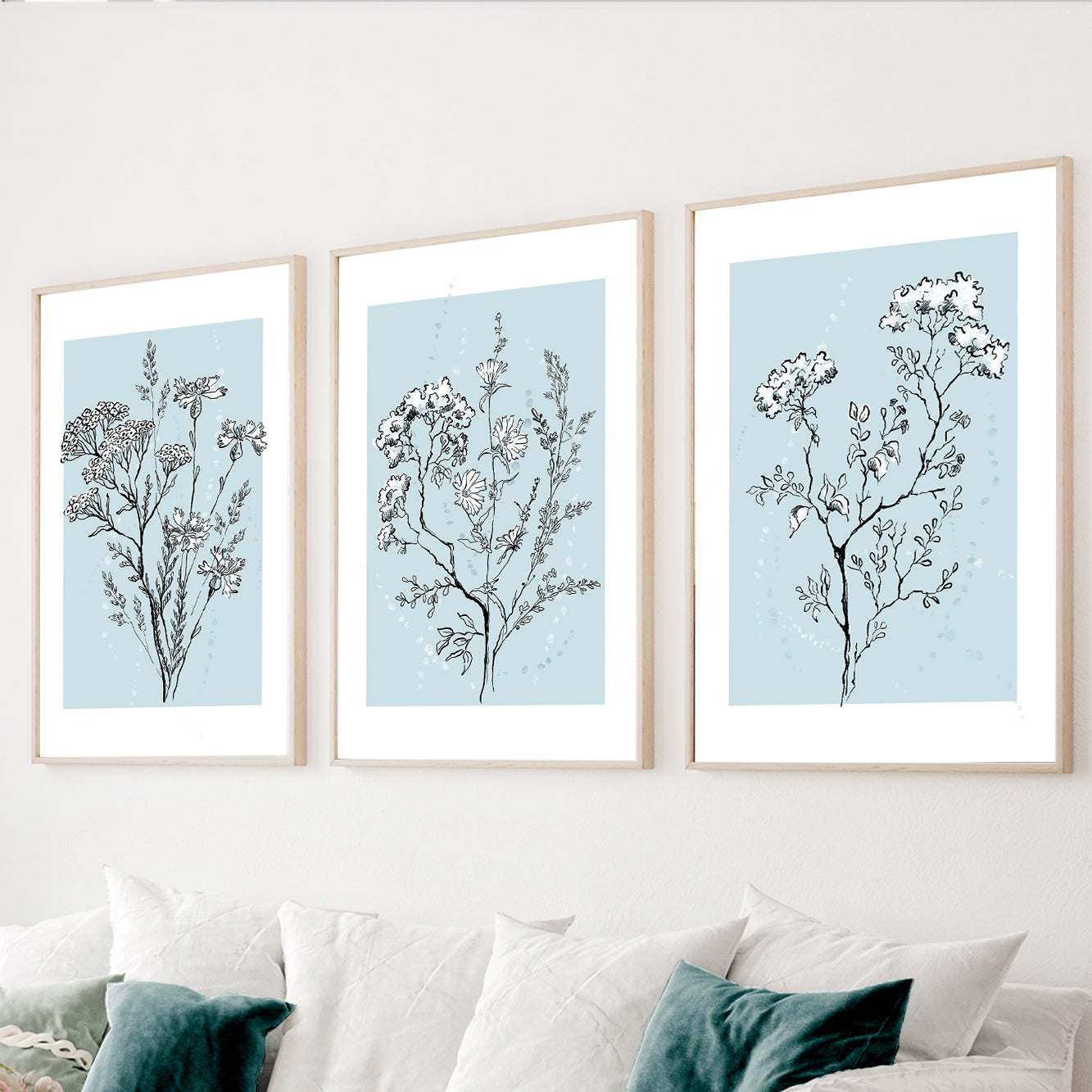 Blue botanical wall art set of 3 with delicate floral line drawings