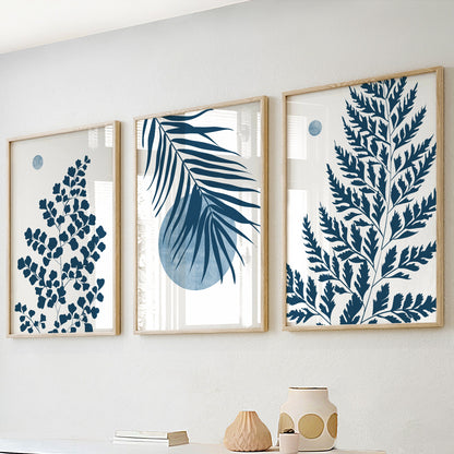Blue botanical wall art showcasing tropical palm leaves, fern foliage and minimalist organic modern styling