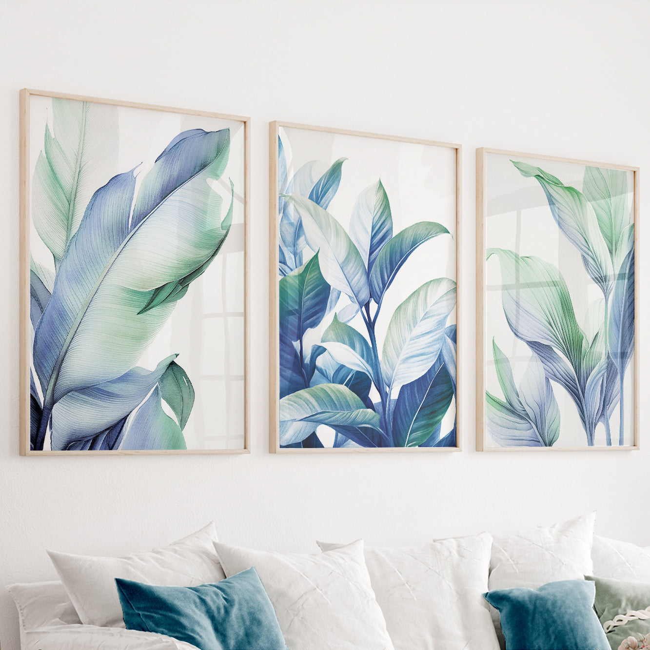 Blue green botanical wall art set of 3 featuring elegant tropical leaves in soft blue and sage green tones