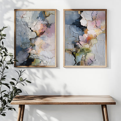 Blue and pink abstract wall art set of 2 displayed in light wood frames above a white sofa