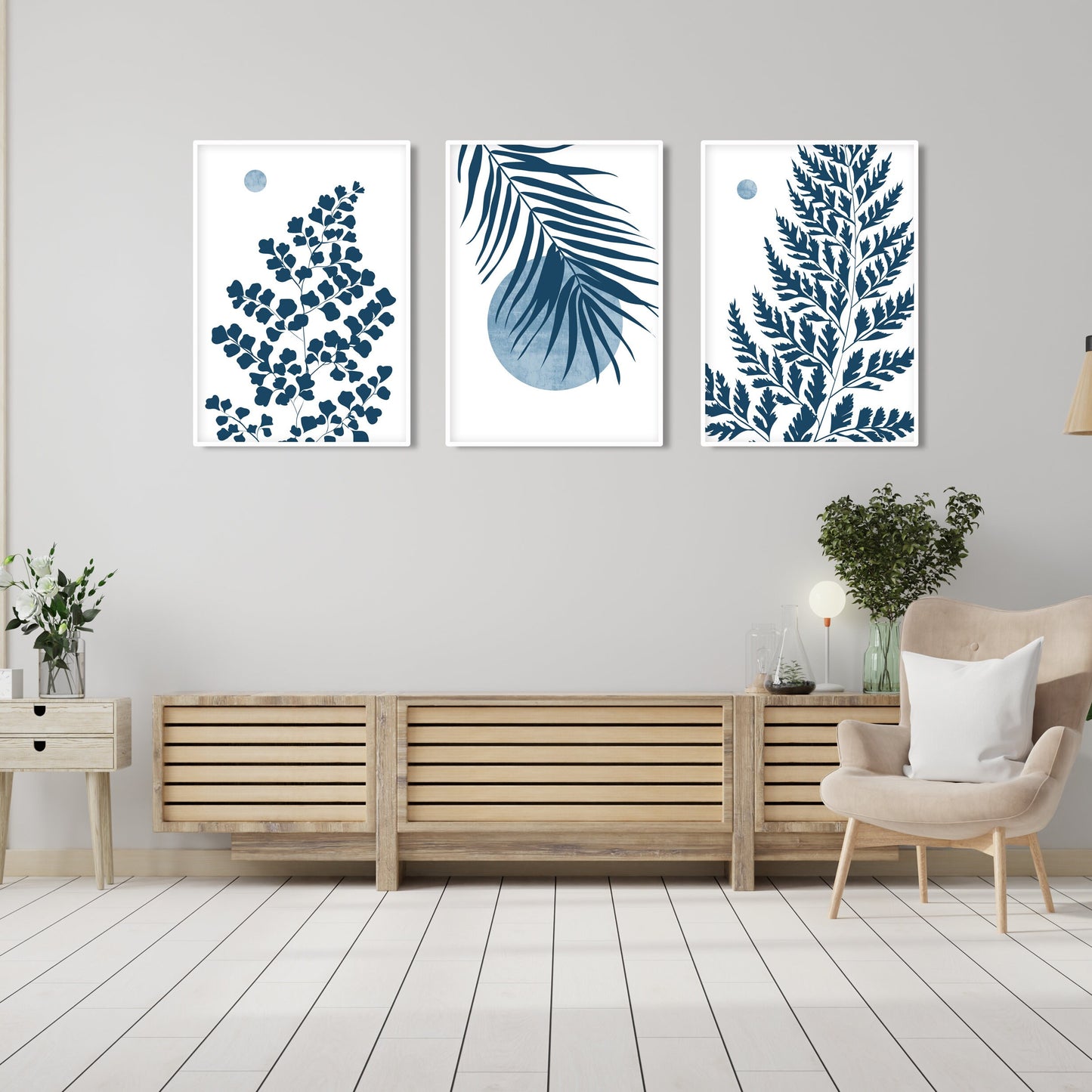 Blue wall decor featuring botanical leaf artwork, tropical foliage and modern minimalist composition