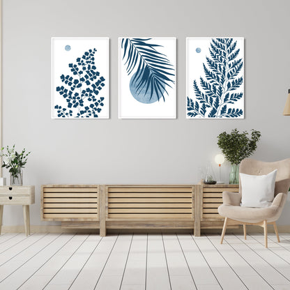 Blue wall decor featuring botanical leaf artwork, tropical foliage and modern minimalist composition
