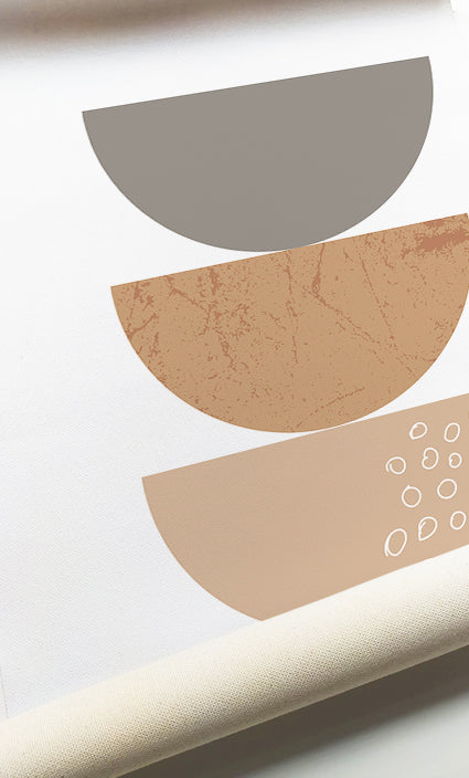 Neutral gallery wall featuring minimalist abstract shapes and contemporary sunburst design