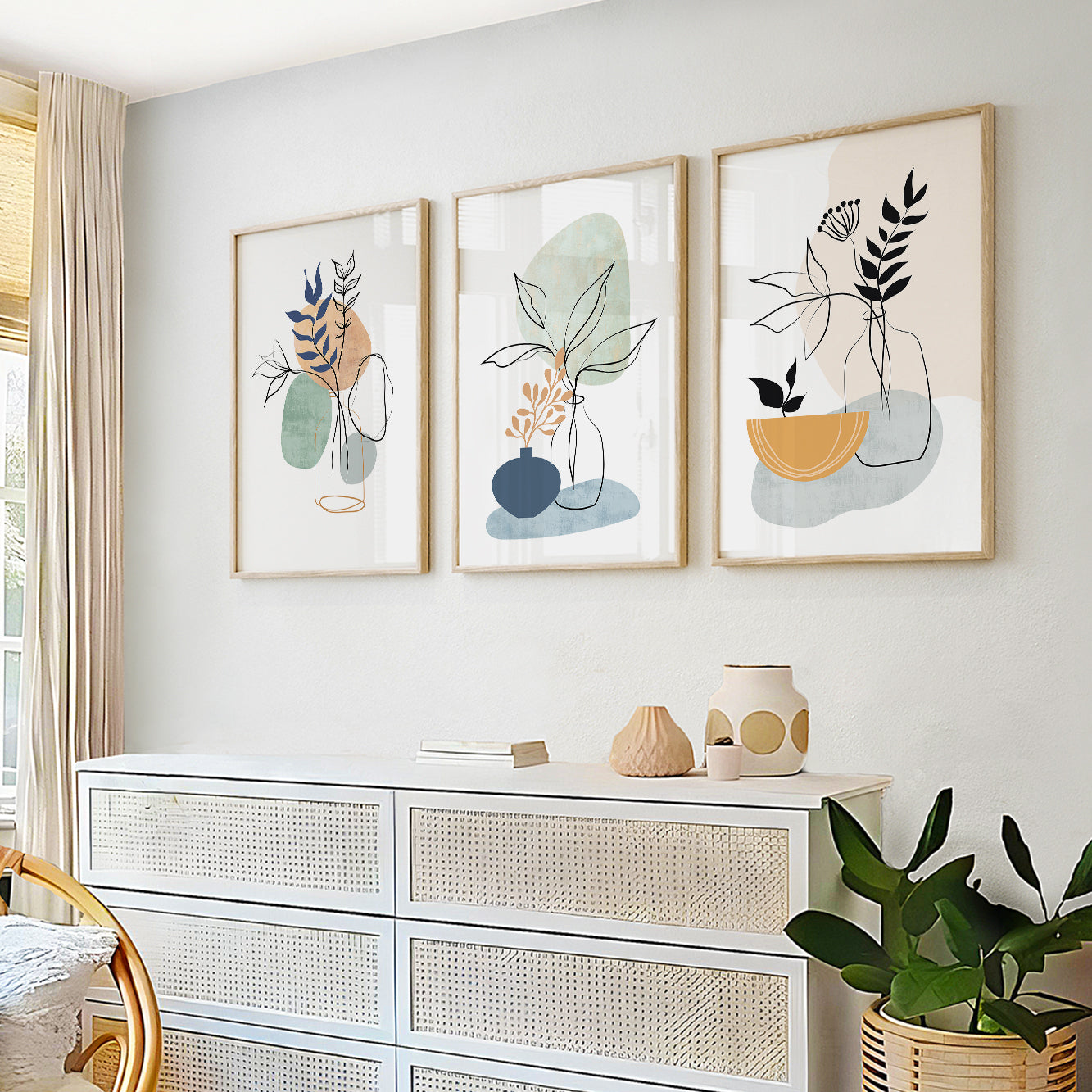 Modern botanical prints with abstract leaves and soft organic shapes in sage green and dusty blue