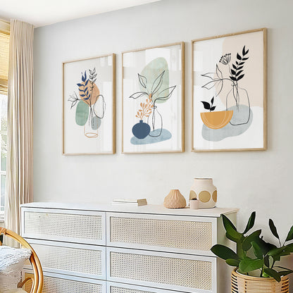 Modern botanical prints with abstract leaves and soft organic shapes in sage green and dusty blue