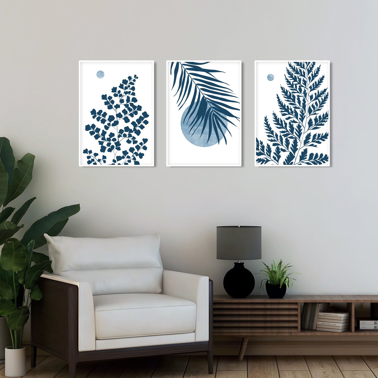 Botanical print set featuring blue foliage artwork with tropical leaves and contemporary organic styling