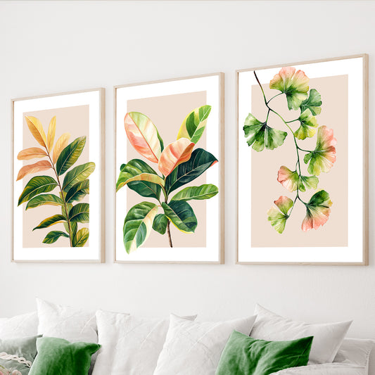 Botanical wall art set of 3 featuring green leaves with soft pink, peach and yellow watercolor accents.