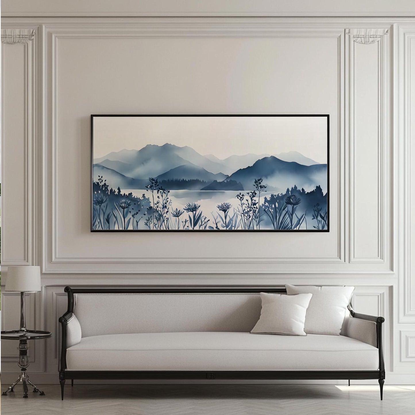 Extra-wide framed mountain landscape print above a sofa for scale reference