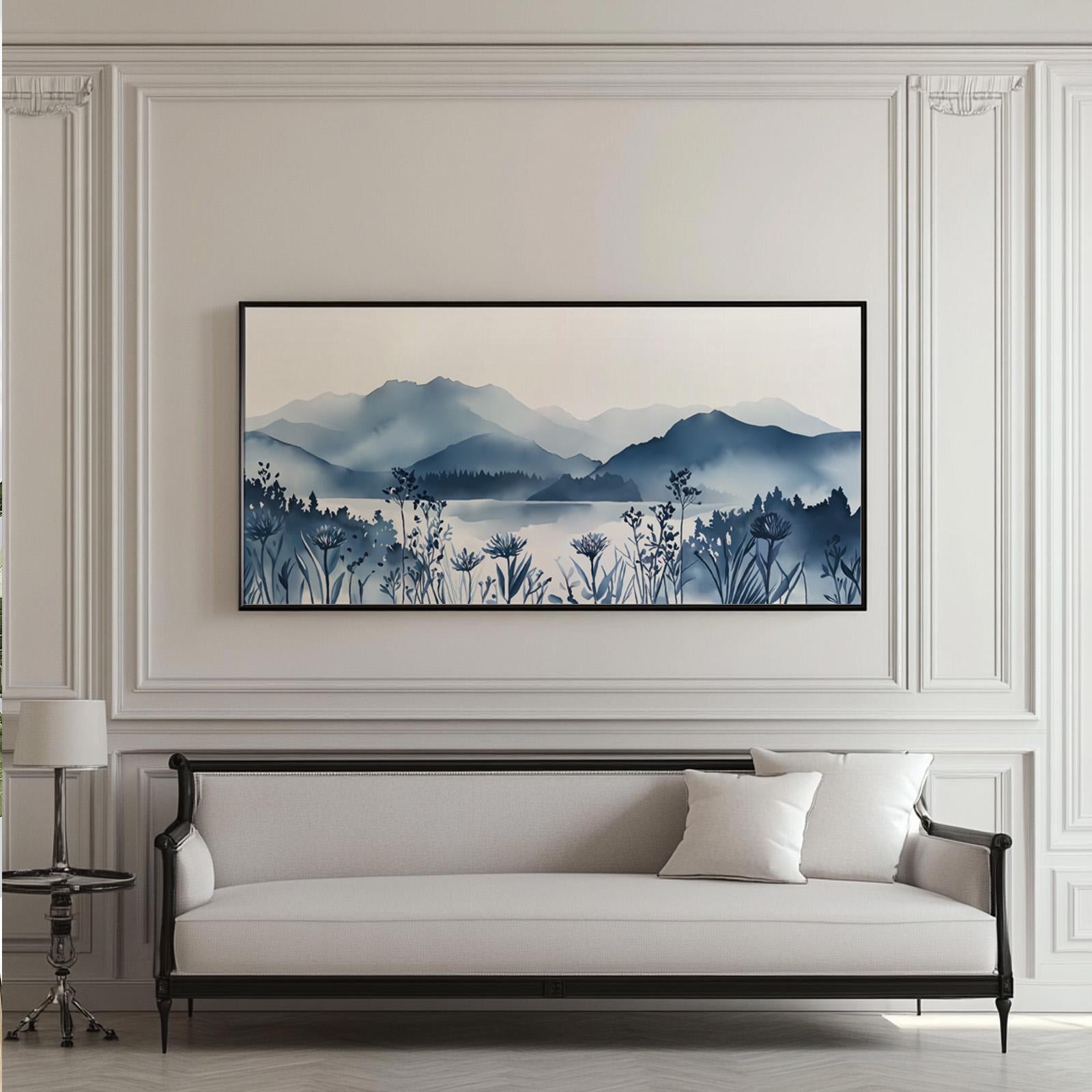 Extra-wide framed mountain landscape print above a sofa for scale reference