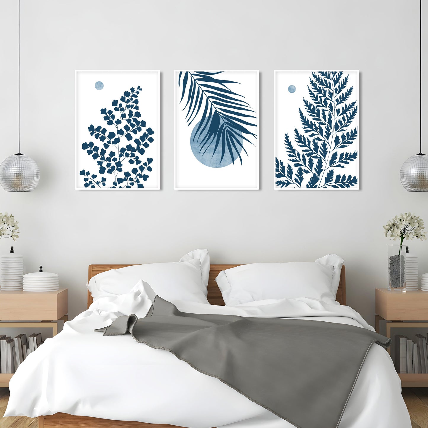 Coastal botanical wall art showcasing blue tropical leaves and airy nature inspired design