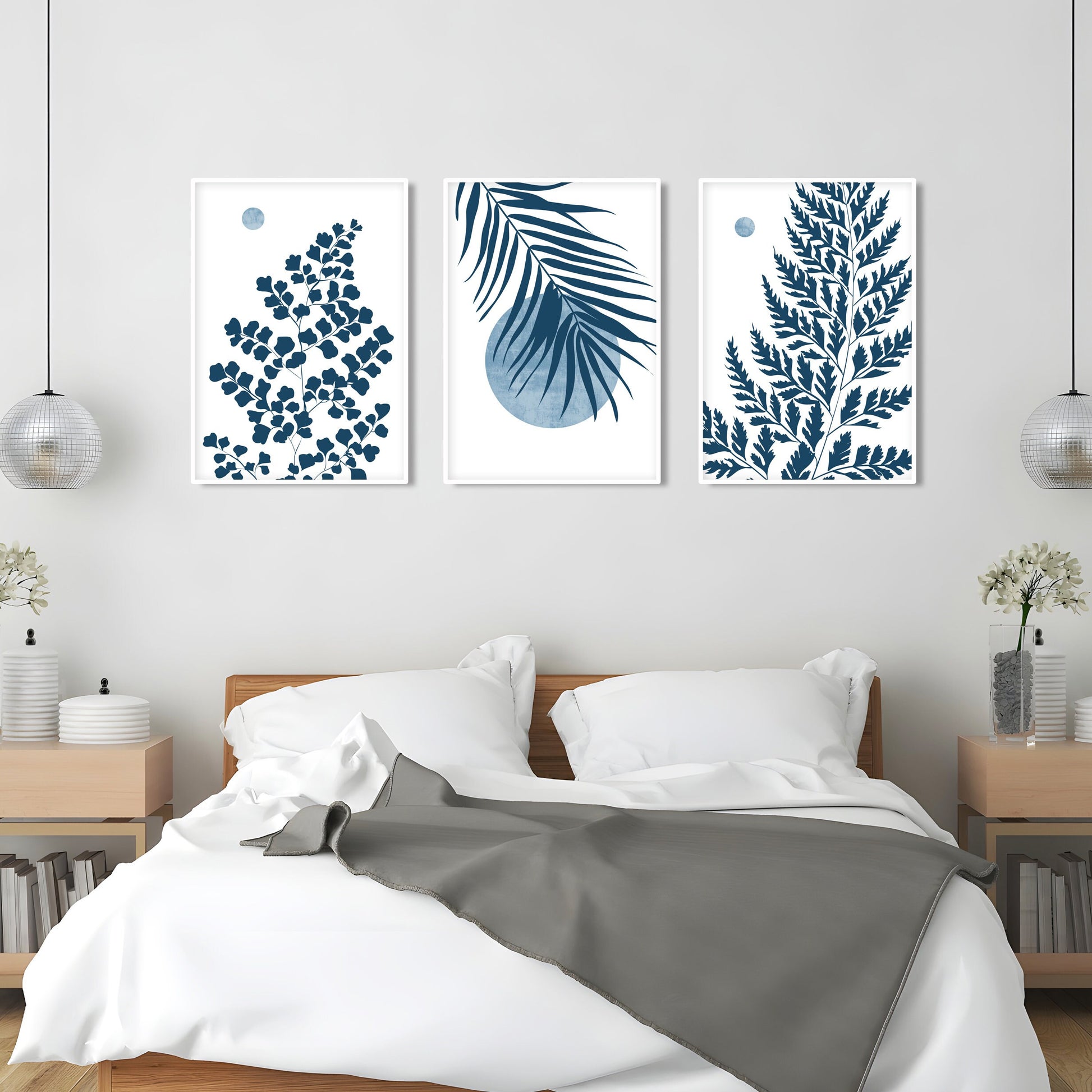 Coastal botanical wall art showcasing blue tropical leaves and airy nature inspired design