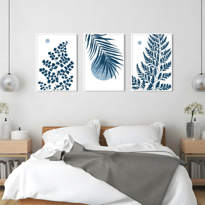 Coastal botanical wall art showcasing blue tropical leaves and airy nature inspired design