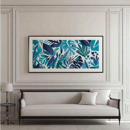 Panoramic blue tropical botanical print in a black frame hung above a classic sofa