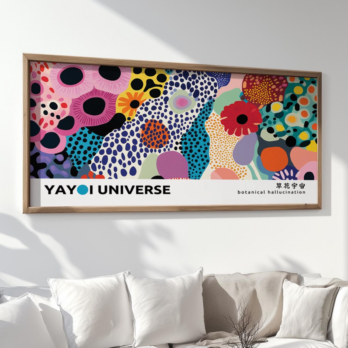 Framed Kusama-inspired floral print hung above a sofa, ready for secure shipment.