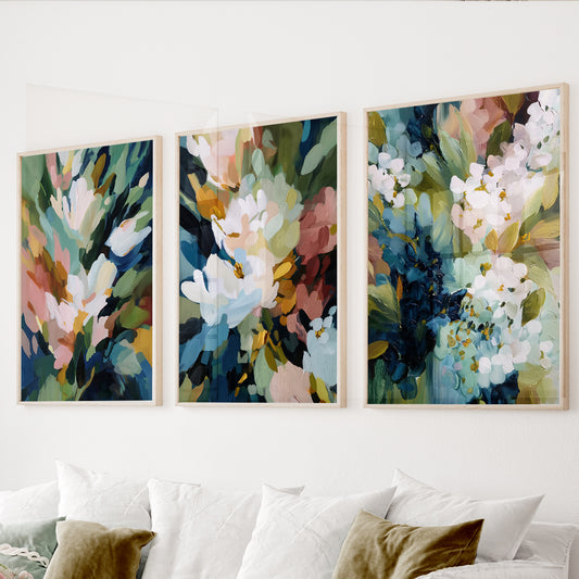 Colorful floral wall art set of 3 featuring painterly flowers in blue, sage green, blush pink, cream and mustard tones.