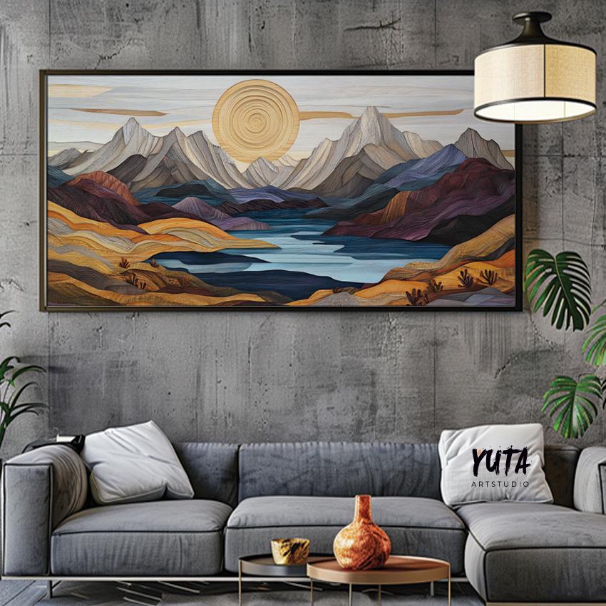 Pastel mountain landscape art in a black frame above a couch with plants and ceramics nearby