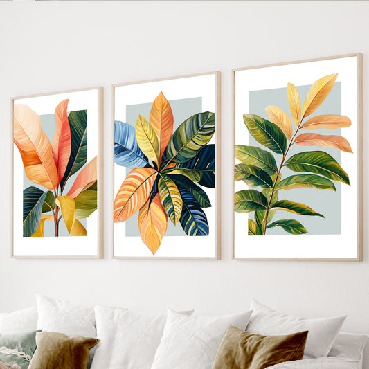 Colorful tropical wall art set of 3 featuring orange, green, yellow and blue botanical leaves.