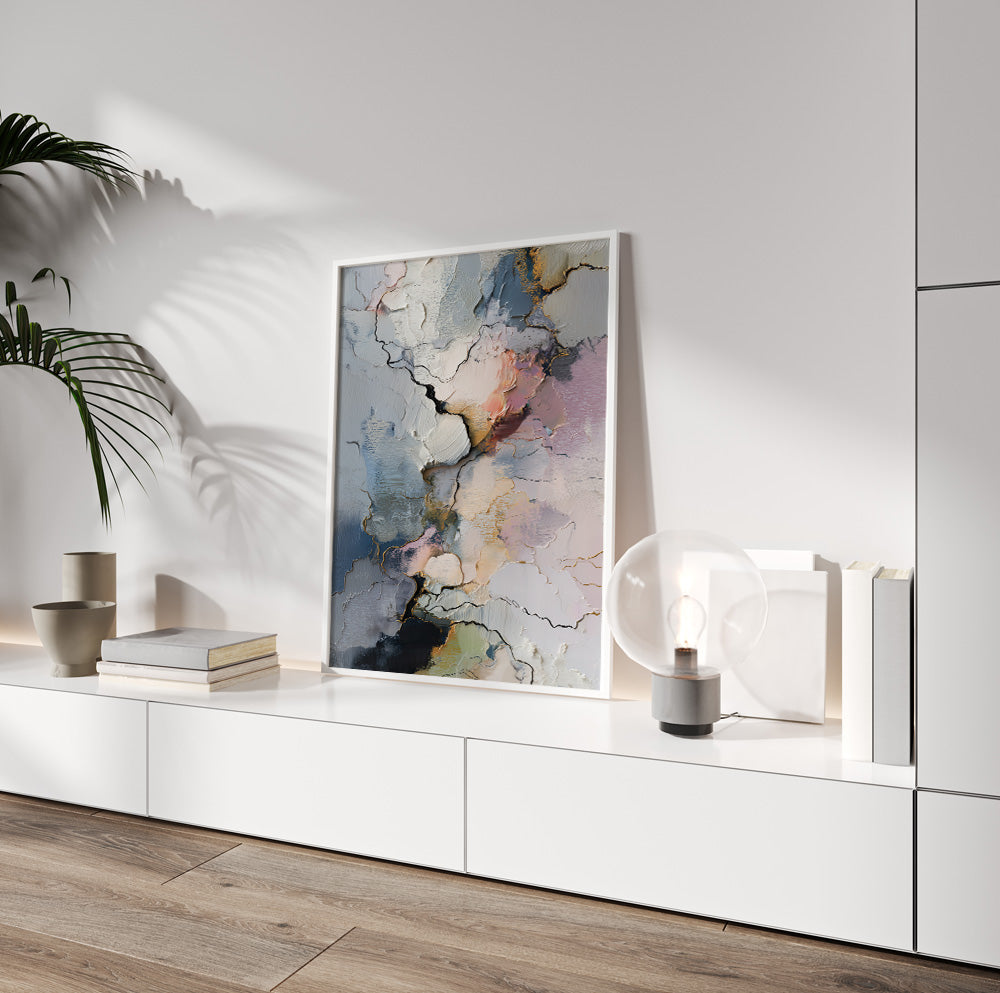 Contemporary abstract wall art set with textured organic forms and soft pastel colors in a bright neutral living room.