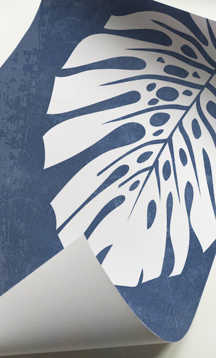 Contemporary botanical artwork combining textured blue backgrounds with white foliage