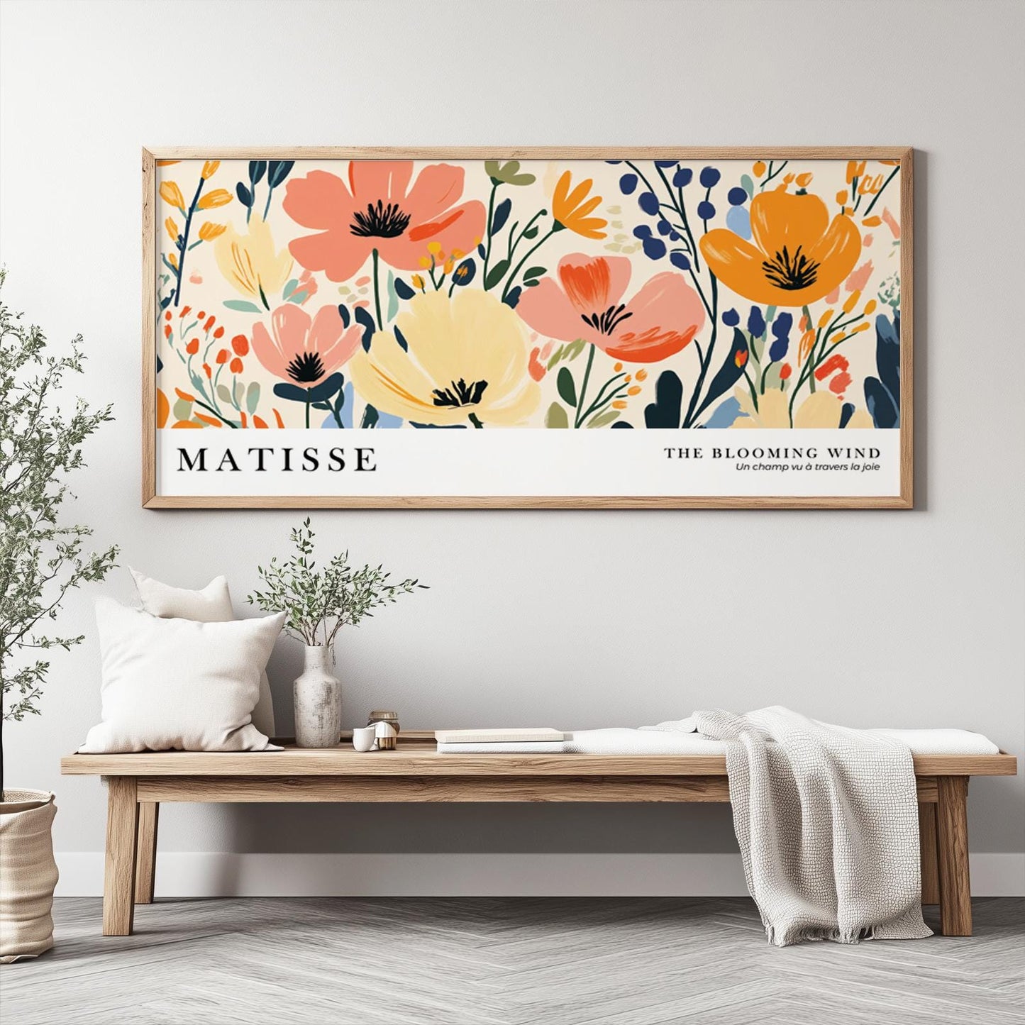 Framed Matisse-inspired floral artwork displayed above a wooden bench with neutral decor.