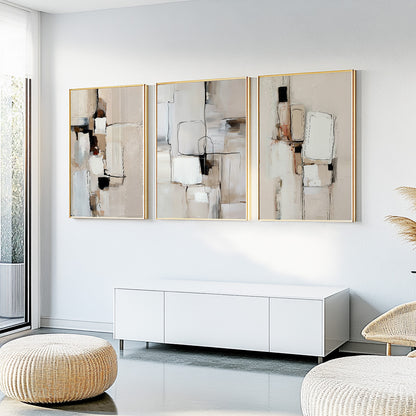 Cream and beige abstract art set of 3 with layered rectangular forms and textured painterly surfaces.