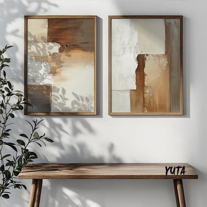 Pair of framed beige and brown abstract prints above a wooden bench, ready for shipping.